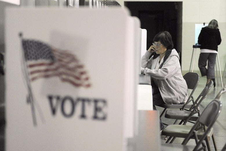 A woman fills out her ballot for the presidential election at the Missouri National Guard Armory on November 8, 2016.